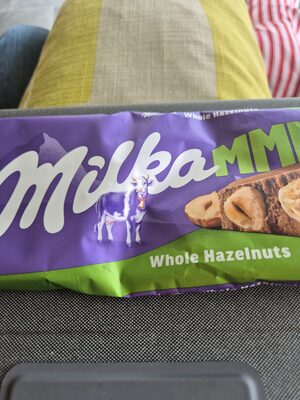 Milka with whole hazelnuts.